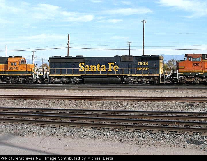BNSF SD-45-2B #7508 is mid consist in the yard